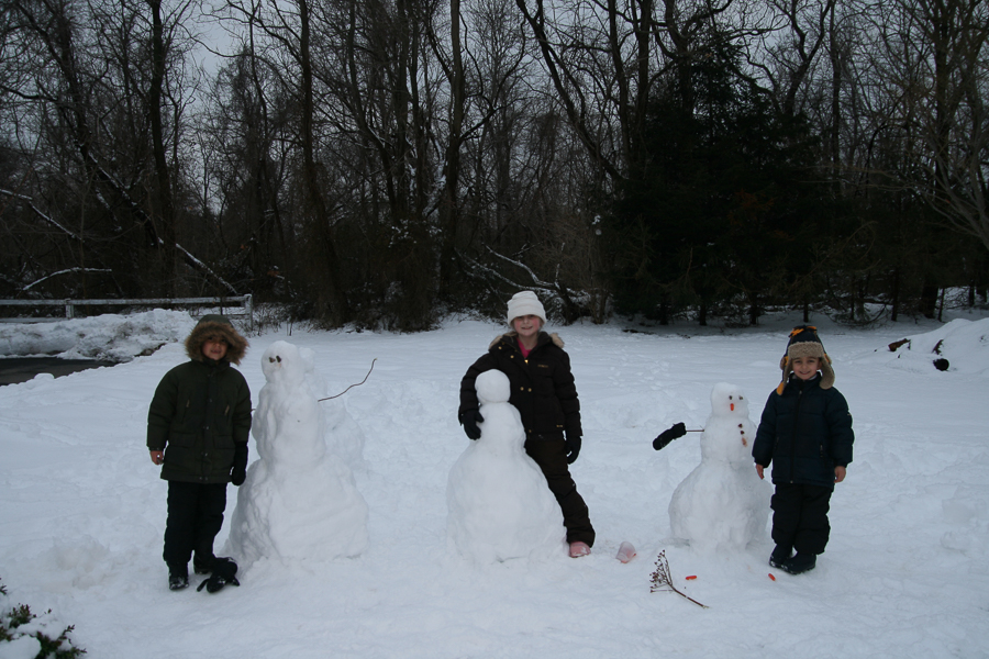 2 snowmen, 1 snowgirl and their creations.