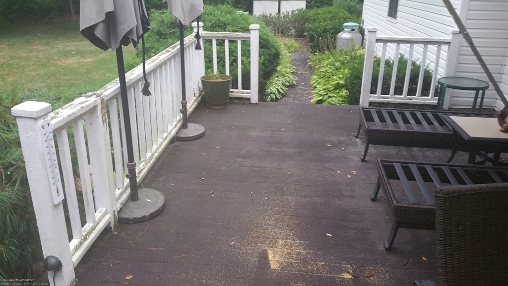 the old circa 1985 cedar railings and covered deck  ~~  this 2 part Rustoleum deck paint is great stuff.  The plan is to power wash it again and recoat.