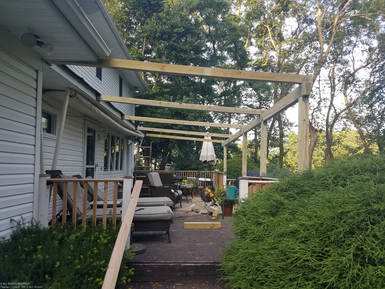 July Project 2017  ~~  New Japanese look pergola.  6.15% grade on a 5% min.  Hope the snow slides off????